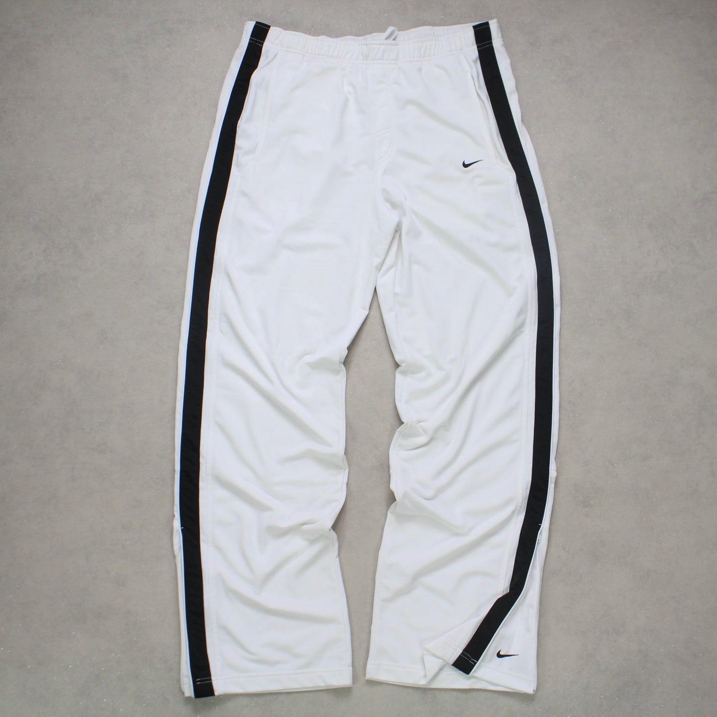 SUPERSELTENE Baggy-Trainingshose von Nike aus den 2000ern, weiß – (L)